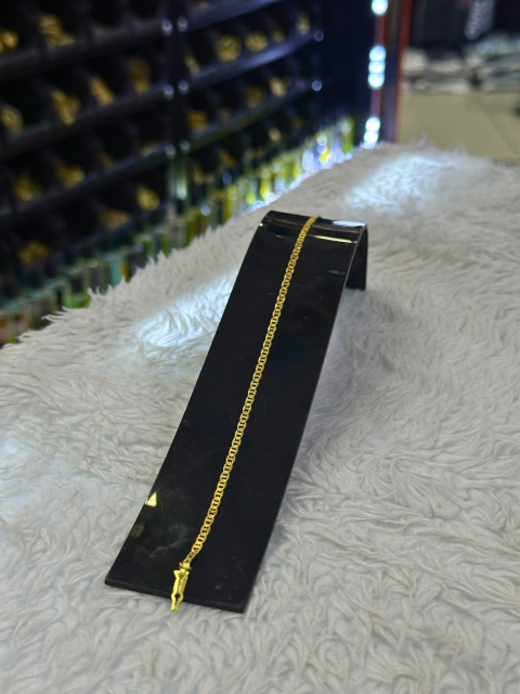 Pulseira piastrini moeda.