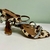 Sandália Animal Print com Pedrarias Carmen Steffens na internet