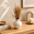 Mini Vaso Bojudo em Cerâmica Off White com Folhagem Natural