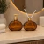 Porta Sabonete Liquido Vidro Âmbar Oval com Tampa Dourada - comprar online