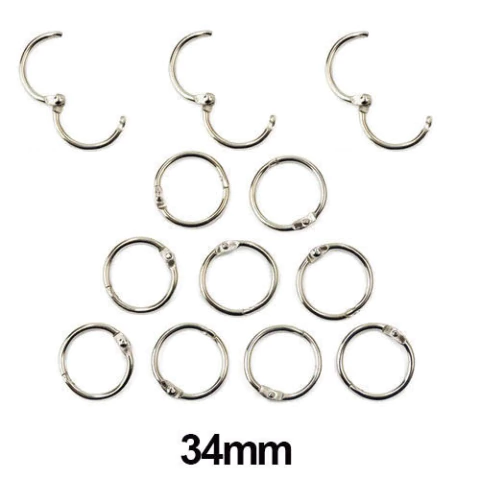 Argola com trava que abre e fecha, utilizada para cartonagem e encadernação.