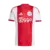 Camisa titular do Ajax 2025/26 com listras vermelha e branca, patrocinador Ziggo, escudo com três estrelas e detalhes da Adidas