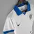 Camisa branca feminina do Brasil 2019 modelo III com gola azul da Nike e escudo da CBF bordado