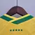 Camisa feminina concept amarela do Brasil 2022 com estampa do Cristo Redentor no peito