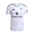 Camisa reserva Manchester United 2025/2026 masculina branca Adidas, modelo oficial com escudo Manchester United em roxo, patrocínio Snapdragon em roxo e detalhes em roxo e preto, para torcedores.