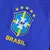 Camisa reserva da Seleção Brasileira 2022 na cor azul, com mangas estampadas inspiradas na jaguatirica, gola arredondada e escudo da CBF bordado