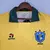 Uniforme retrô da Seleção Brasileira de 1988 na cor amarela com gola verde e logo da Topper, modelo clássico e histórico dos anos 80