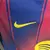 Camisa titular FC Barcelona 2025/2026 feminina, listrada em azul e grená, com escudo FCB, patrocínio Spotify e gola V, para torcedoras.