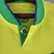 Camisa amarela titular da Seleção Brasileira 2022, com detalhes em verde, gola com botão e escudo da CBF atualizado, modelo Nike para a Copa do Mundo do Catar
