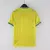 Camisa amarela titular da Seleção Brasileira 2022, com detalhes em verde, gola com botão e escudo da CBF atualizado, modelo Nike para a Copa do Mundo do Catar
