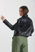 Campera Ecocuero cruzada con tachas, cierres en los puños y detalle de pespunte en la mangas. Art: 7271 en internet