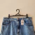 Short Mindse7 jeans claro barra desfiada etiqueta bege atrás - Holly Brechó e Outlet