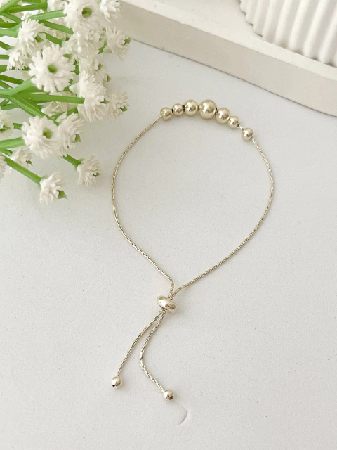 Pulseira Bolas Fecho Gravatinha - comprar online