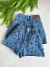 Short jeans bordado onçinha