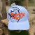 BONÉ COUNTRY STYLE BRANCO DET LARANJA na internet