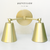 Aplique de pared modelo MINI de 2 luces dorado mate con movimientos en las pantallas