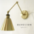 Aplique de pared dorado mate con múltiples movimientos verticales en 3 sectores - comprar online