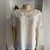 Blusa branca detalhe Alessi (G) na internet