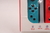 CONTROLE - NINTENDO SWITCH JOYCON VERMELHO E AZUL (1) - Gamefic Jogos - Loja de vídeos games novos e retrô.