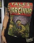 Blusinha negra con diseño retro de cómic de horror "Tales from Varginha" con alienígena de ojos rojos y texto en colores rojo, amarillo y verde.
