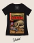 Black t-shirt featuring a vintage comic book design of the Chupacabra, showcasing a creature attacking a goat with illustrations of characters on the side.