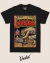 A black t-shirt featuring a retro comic book design titled "The Terrifying Legend of Chupacabra," depicting a monstrous creature and characters from the story.