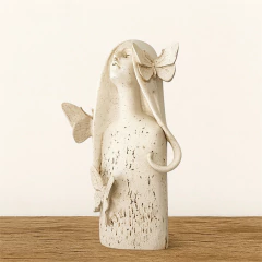 Escultura Menina Borboleta na internet