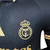 Imagem do Camisa Real Madrid Edição Especial Polo 2024/25 Jogador Masculina - Preta e Dourada