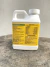 Frasco branco do fertilizante Super Thrive Bloom de 236ml com selo de lacre original na tampa e rótulo amarelo com detalhes em verde e vermelho