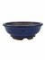 Vaso de cerâmica para bonsai na cor azul, com medidas de 20x6,5 cm, apresentando um design arredondado e base elevada.