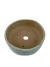 Vaso de cerâmica artesanal para bonsai, na cor verde erva doce, com furos de drenagem no fundo.