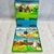 Caja de libros infantiles sobre animales de la granja, con ilustraciones coloridas de un cordero, una cabra, una gallina y un ganso.