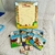 Juego educativo infantil con libros ilustrados de animales de granja y una hoja para escribir.