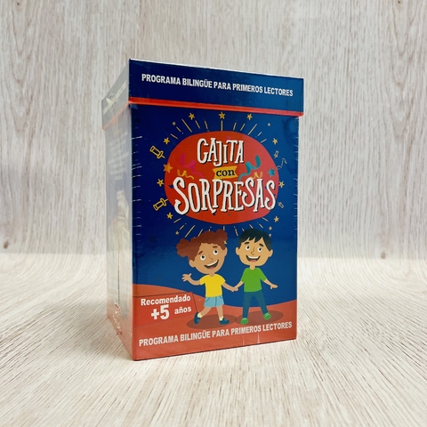 Cajita Mágica Bilingüe para niños mayores de 5 años, con diseño colorido y dibujos de niños sonrientes en la caja