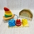 Kit de dos juegos de encastres infantiles de madera con piezas de colores y formas variadas, incluyendo un barco con velas de colores y un arco iris apilable.