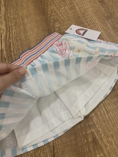 Short saia com coz de elástico listrado azul e branco flores\fundo do mar (Quebra Cabeça) - Babies Move Brecho