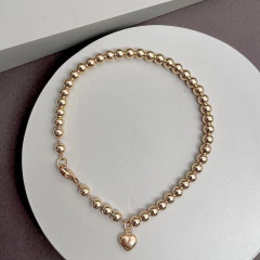 Pulsera cadena y bolitas de Goldfilled - comprar online