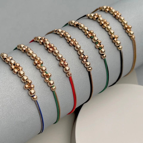 Pulseras bolitas de goldfilled con 2 hilos seda - comprar online