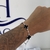 Pulseira Florzinha Branca/Preta - MaClah® | Semijoias