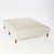 Base sommier 2 plazas Naturalfoam con patas de madera y tapizado claro