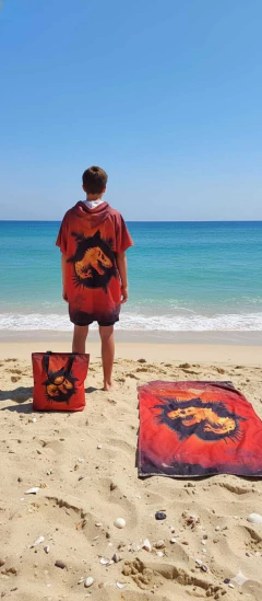 Set Bolso Con Poncho Y Toallon Jurassic Dinosaurios en internet