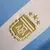 Camisa Seleção da Argentina I 24/25 - Torcedor Adidas Feminina - Branca com listras em azul - CAMISA DE FUTEBOL,CAMISA DE BASQUETE E CORTA VENTO / FUTCAJ