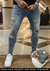 Calça Super Skinny estonada Rasgada e repingos barra Desfiada - comprar online