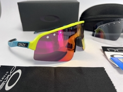 Gafas Oakley Sutro Lite Sweep Vented Marco Amarillo Patilla Celeste Espejado Naranja - MendoBike
