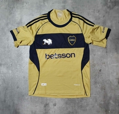 Camiseta Boca Betsson 2026 suplenete dorada