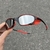 Óculos de Sol Juliet Carbon Liquid Metal + Sideblinder Red + Kit Borracha Red - comprar online