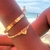 bracelete coração e ponto de luz dourado - Emi acessórios