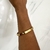 bracelete coração e ponto de luz dourado - comprar online