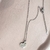 colar coracao strass