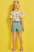 Conjunto infantil Kukiê de Blusa Cropped em Canelado e Shorts Saia em Jeans - Costas